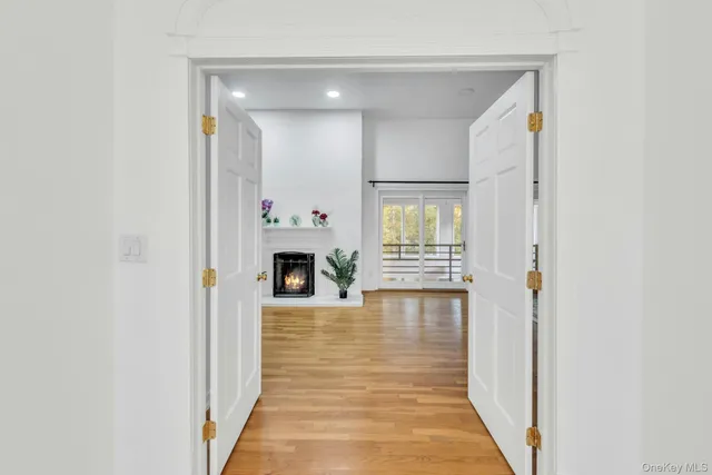 a view of livingroom with kitchen and fireplace