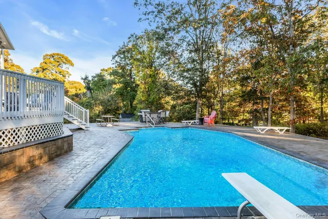 a front view of a house with a garden and sitting area