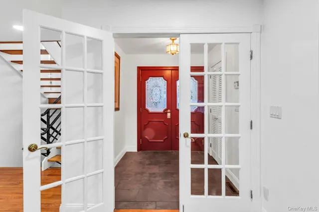 a view of front door with hallway and stairs