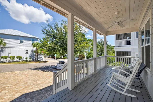 a view of a chair and tables in the balcony