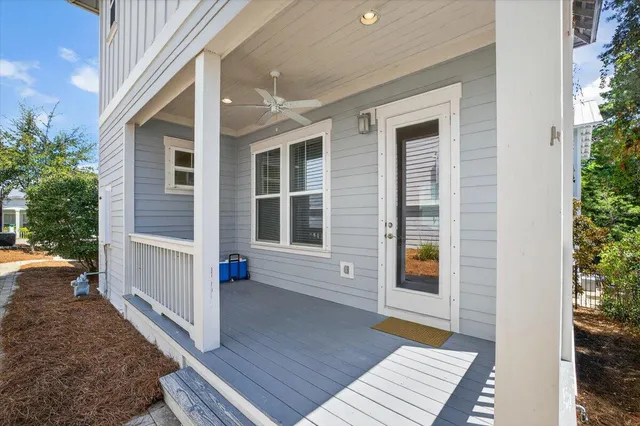 a view of a house with a door and wooden floor