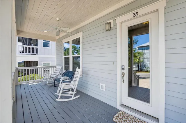 a balcony with table and chairs