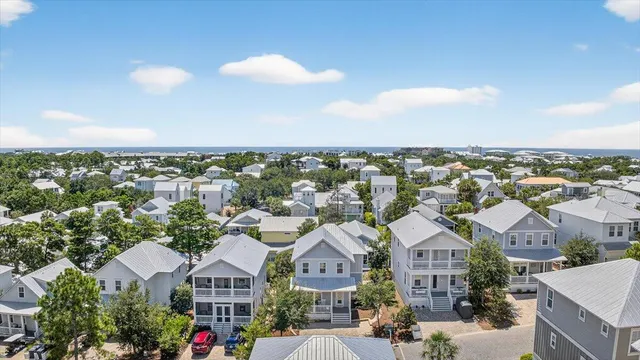 an aerial view of residential houses with city view