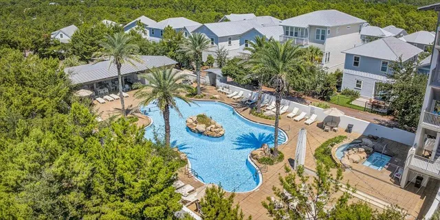 an aerial view of a house with swimming pool and outdoor space
