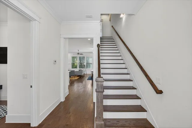 a view of entryway and hall with wooden floor