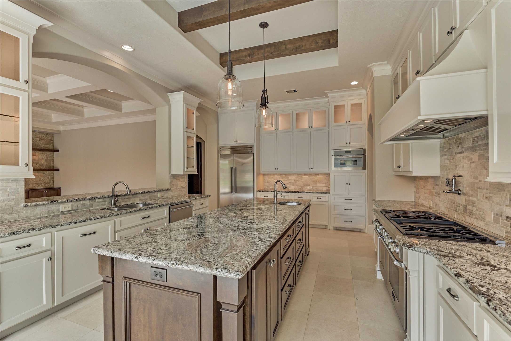 25 Post Shadow Estate Drive Spring, TX 77389 - Photo 14 of 49 a kitchen with stainless steel appliances granite countertop a sink stove and cabinets