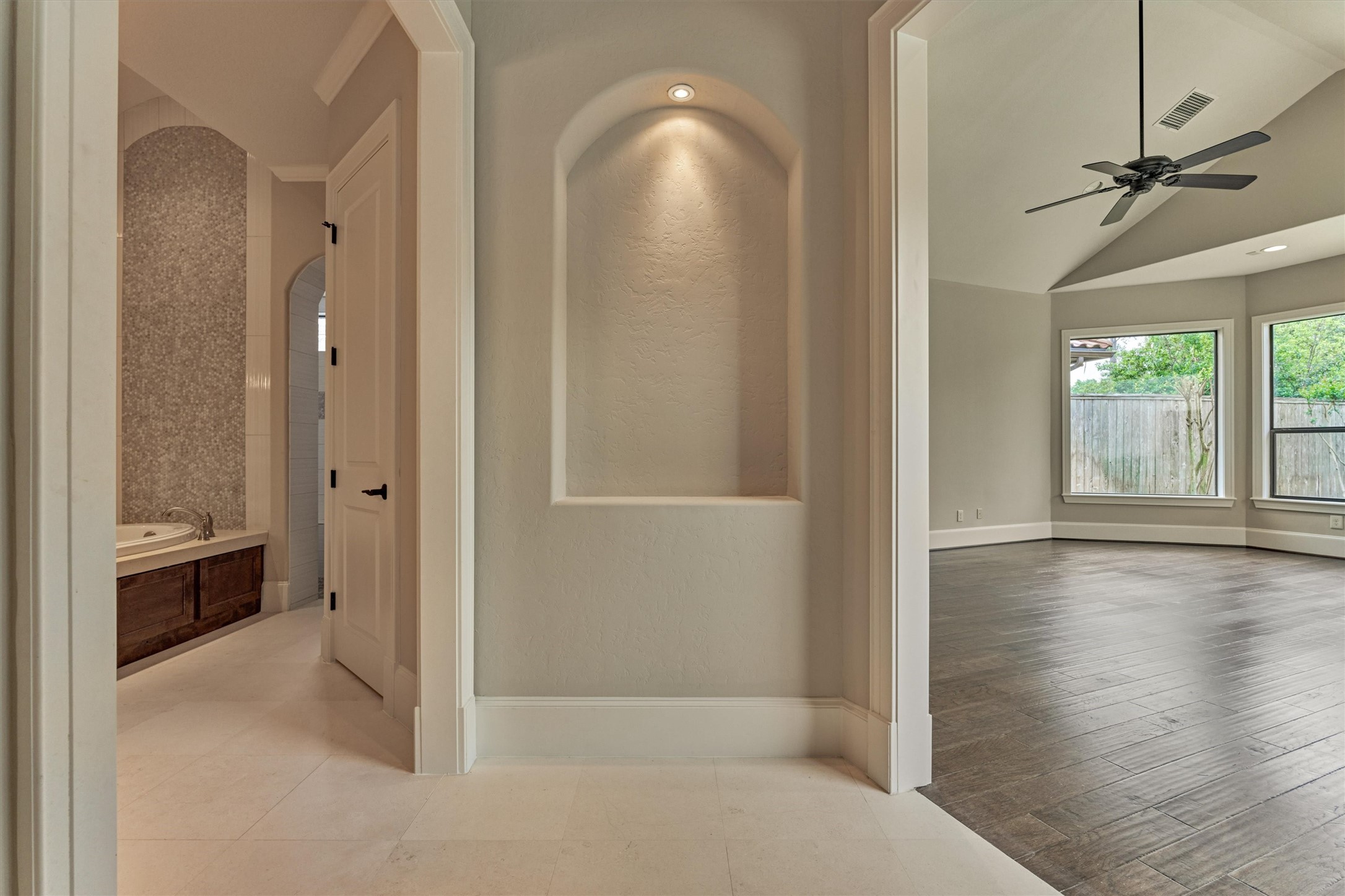 25 Post Shadow Estate Drive Spring, TX 77389 - Photo 21 of 49 a view of a bathroom from a hallway