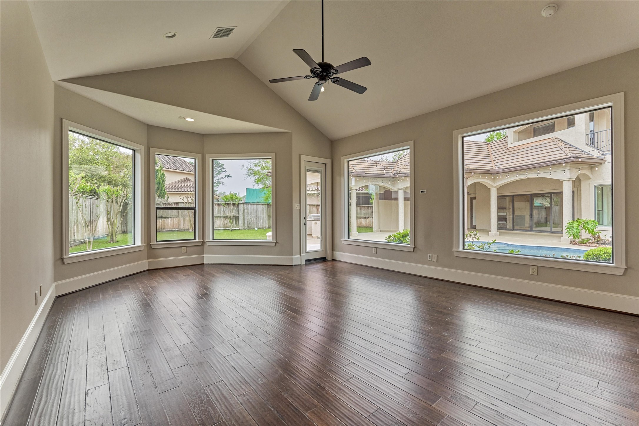 25 Post Shadow Estate Drive Spring, TX 77389 - Photo 22 of 49 a view of an empty room with wooden floor and a window