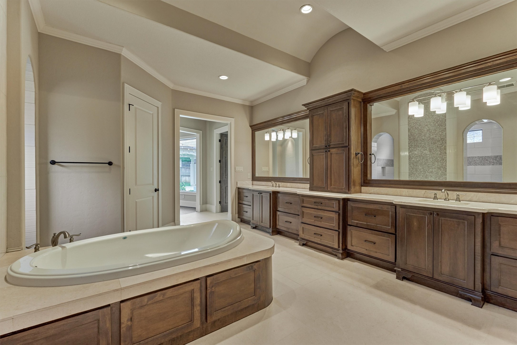25 Post Shadow Estate Drive Spring, TX 77389 - Photo 26 of 49 a spacious bathroom with a granite countertop sink mirror and a bathtub