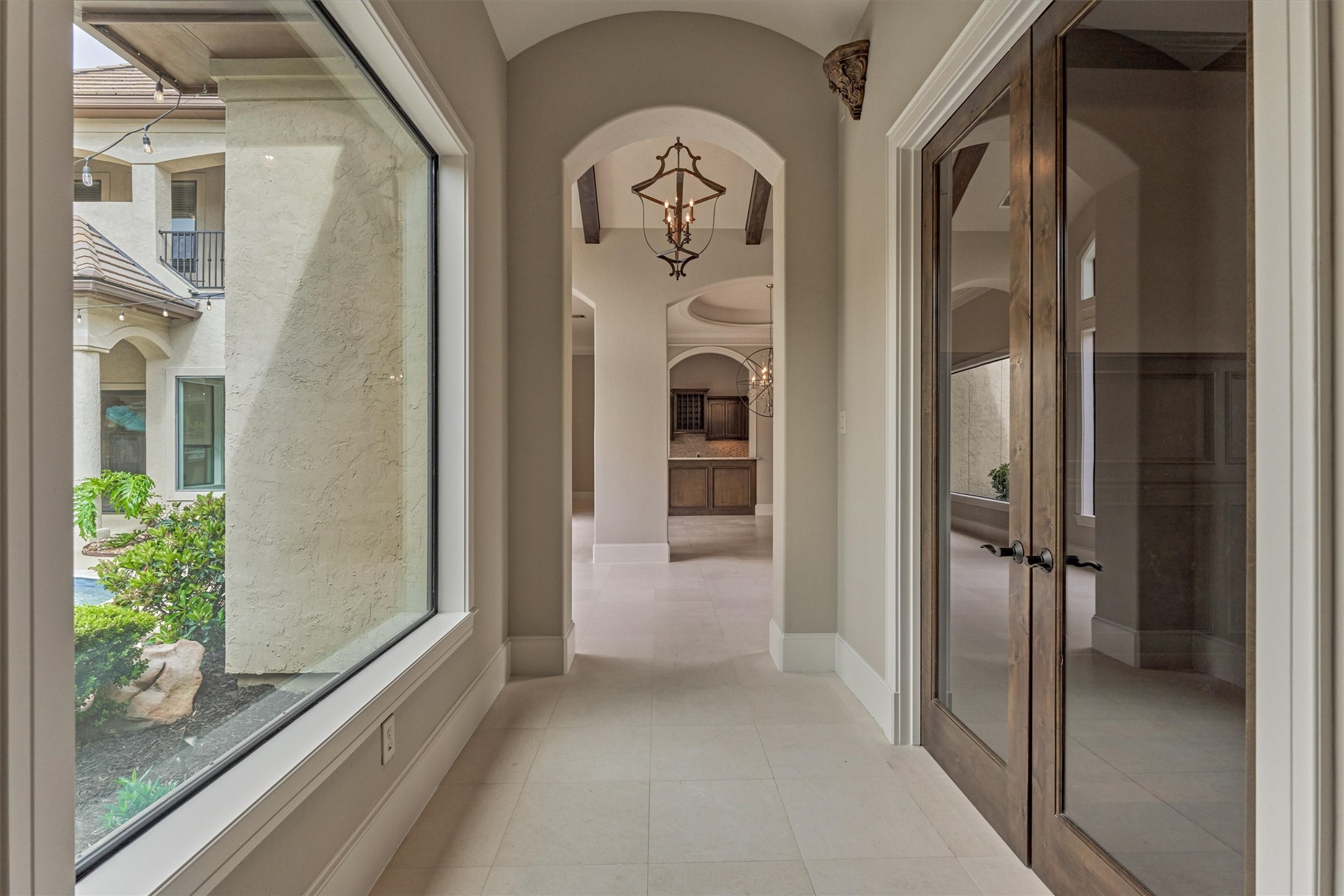 25 Post Shadow Estate Drive Spring, TX 77389 - Photo 28 of 49 a view of a hallway with entryway wooden floor windows and livingroom