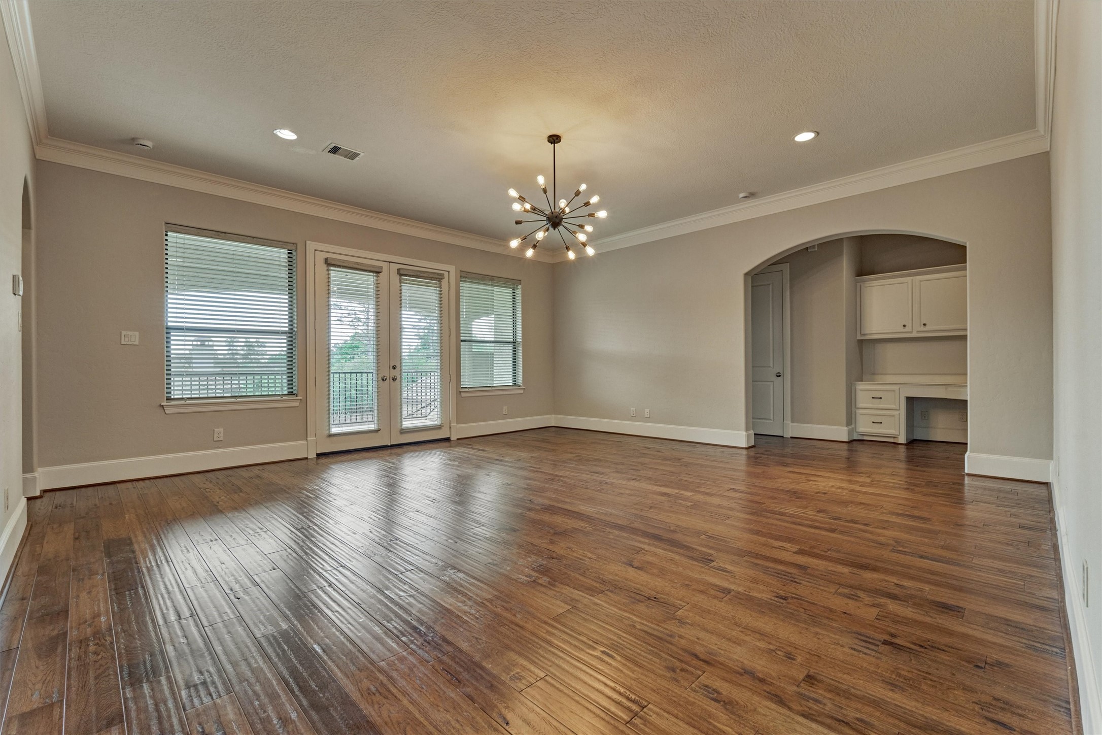 25 Post Shadow Estate Drive Spring, TX 77389 - Photo 34 of 49 a view of an empty room with wooden floor and a window