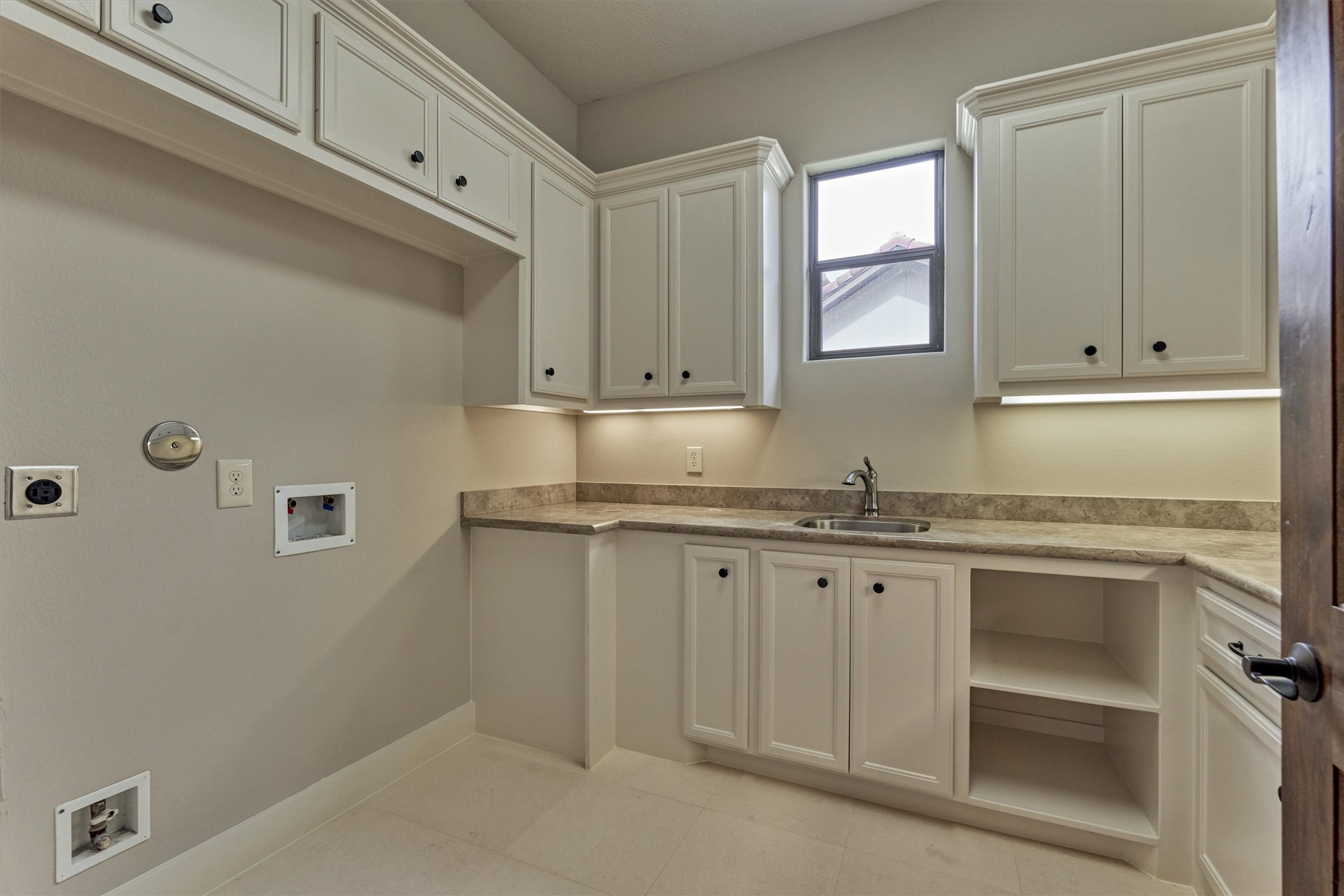 25 Post Shadow Estate Drive Spring, TX 77389 - Photo 41 of 49 a bathroom with granite countertop cabinets and white appliances