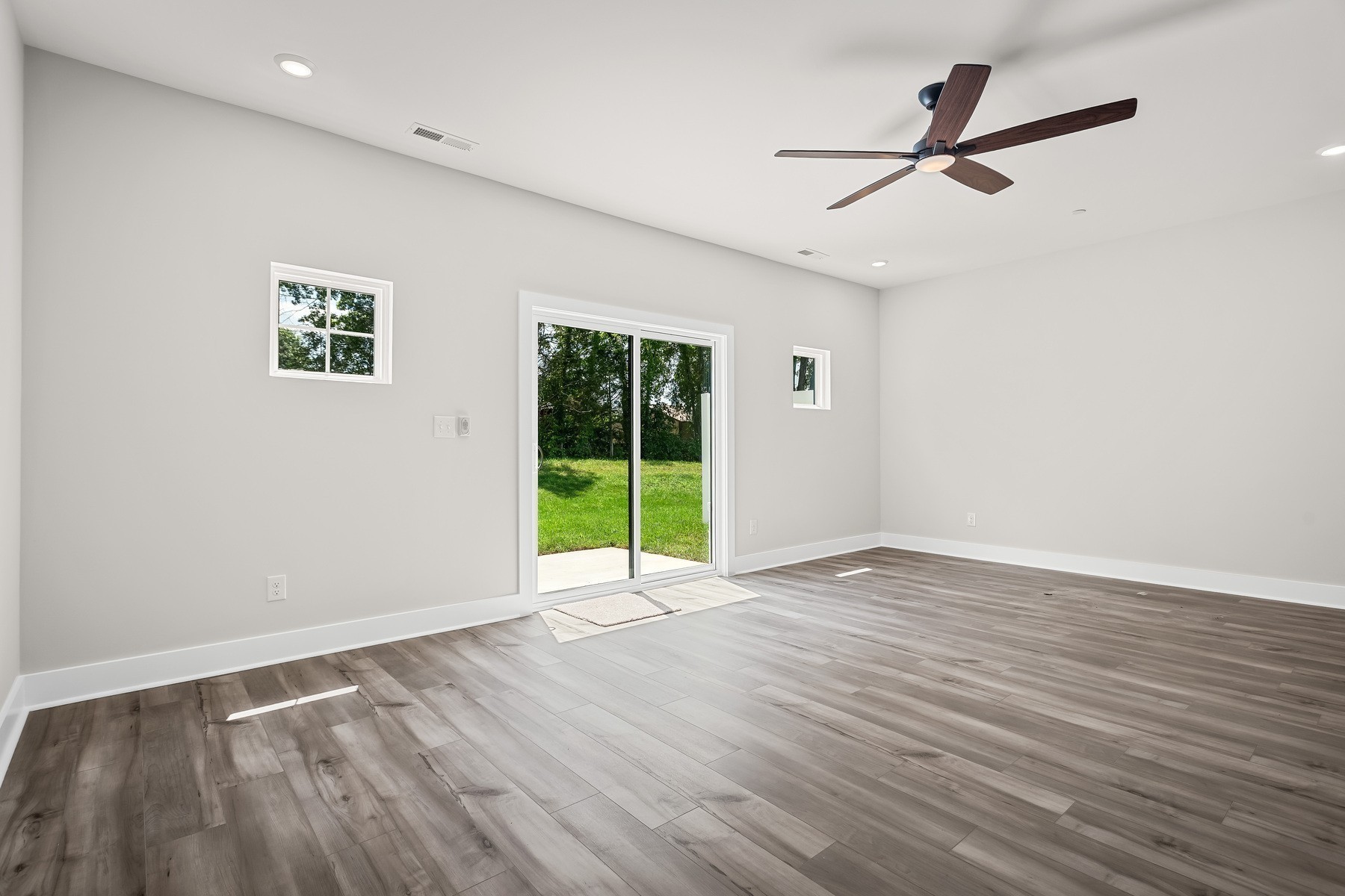 4007 Norman Drive Spring Hill, TN 37174 - Photo 5 of 12 a view of an empty room with wooden floor and a window