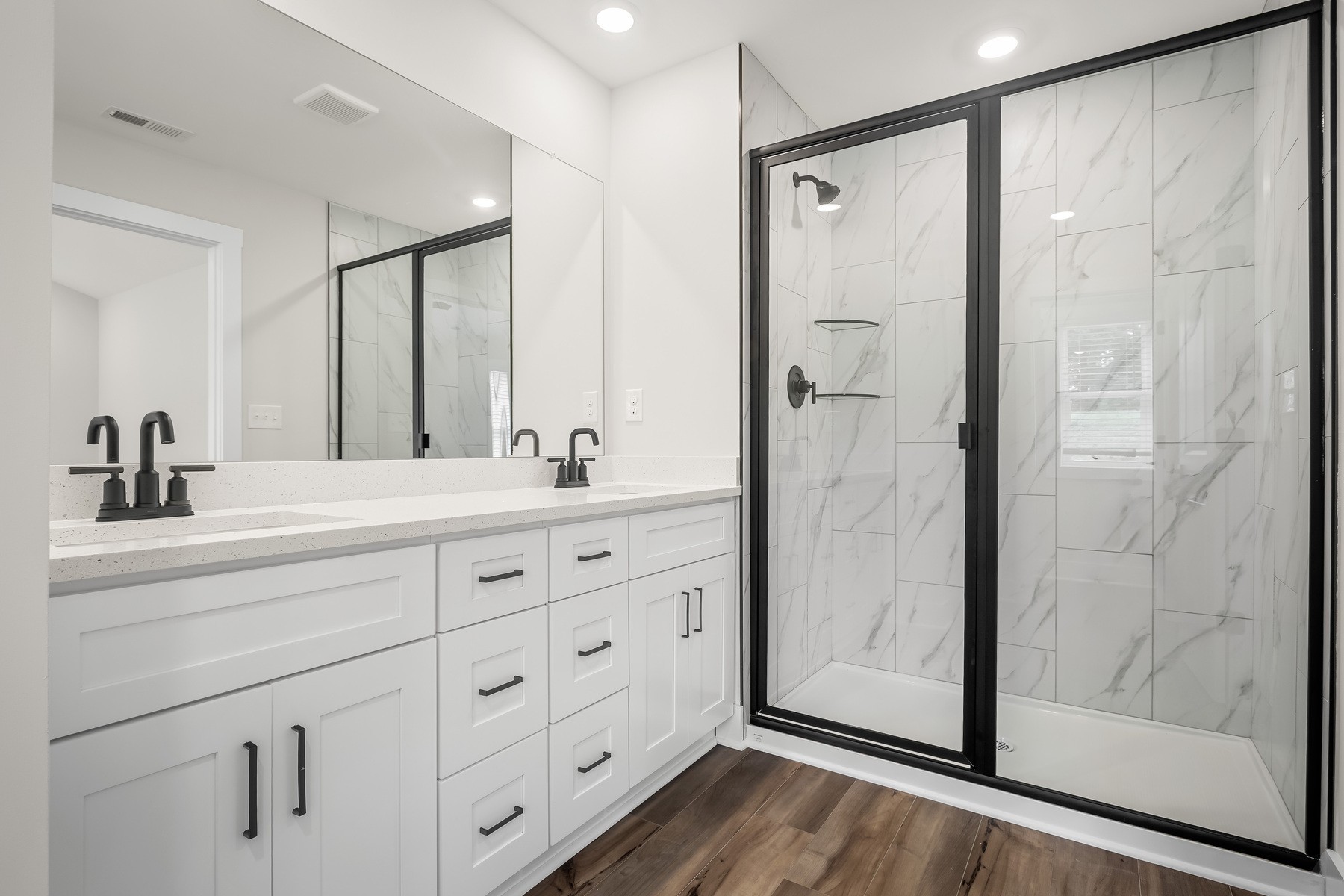4007 Norman Drive Spring Hill, TN 37174 - Photo 10 of 12 a bathroom with a double vanity sink mirror and shower