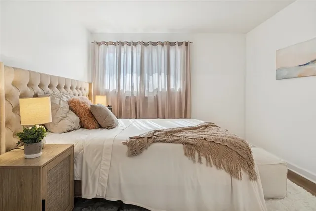 a bedroom with a bed and a cabinets