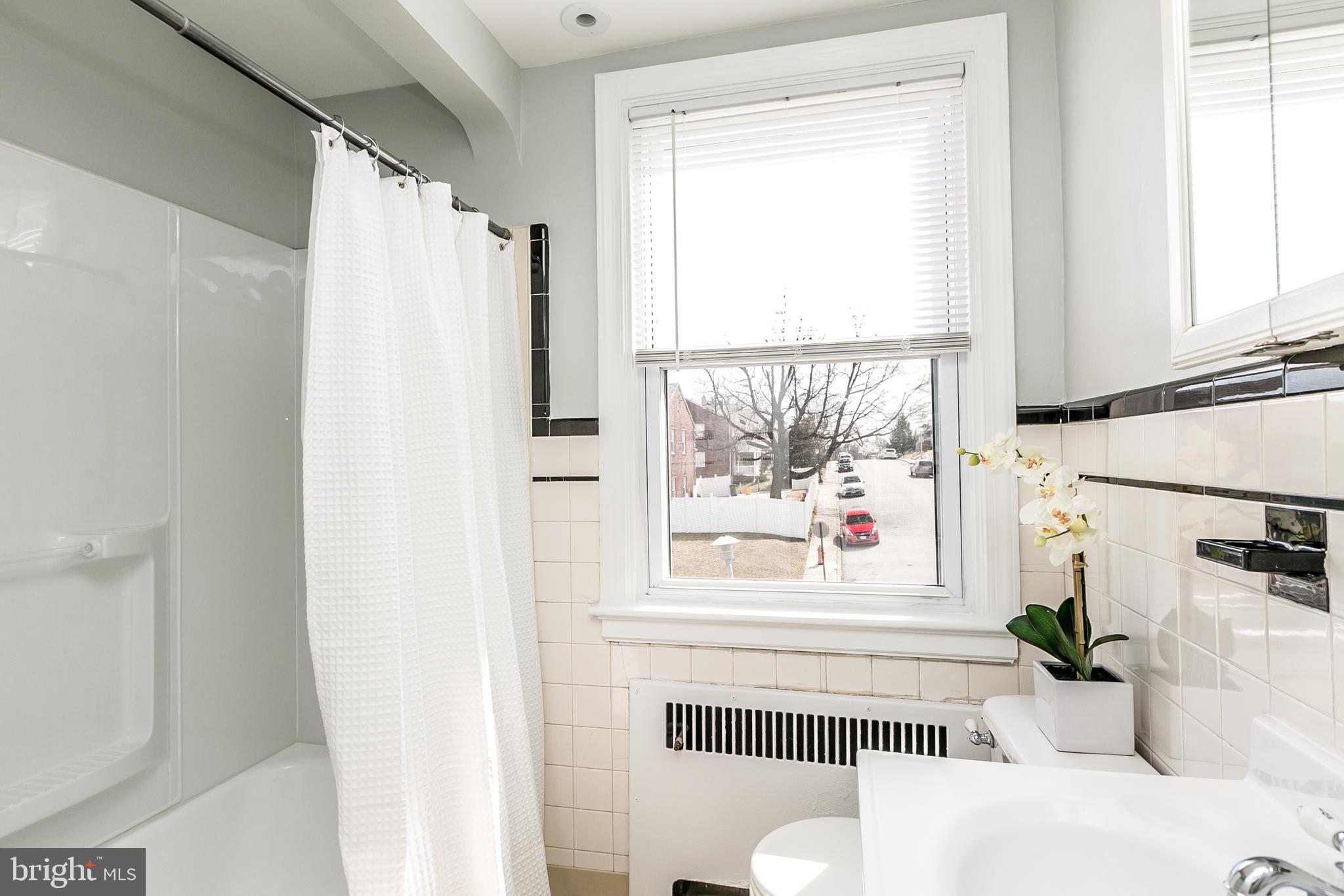 1000 Andover Road Baltimore, MD 21218 - Photo 21 of 31 Upstairs bathroom with ceramic tile