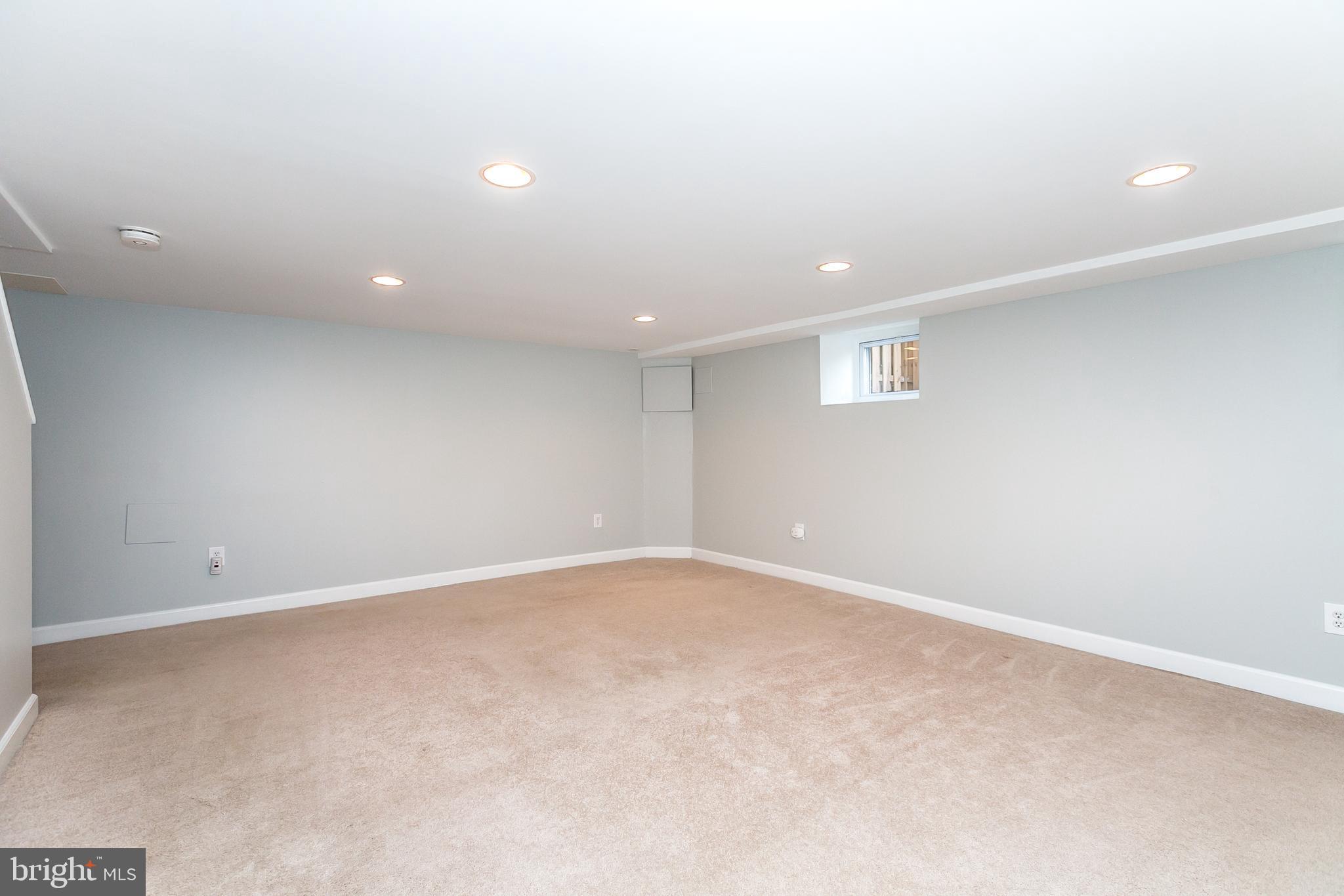 1000 Andover Road Baltimore, MD 21218 - Photo 23 of 31 Lower level family room with wall to wall carpet