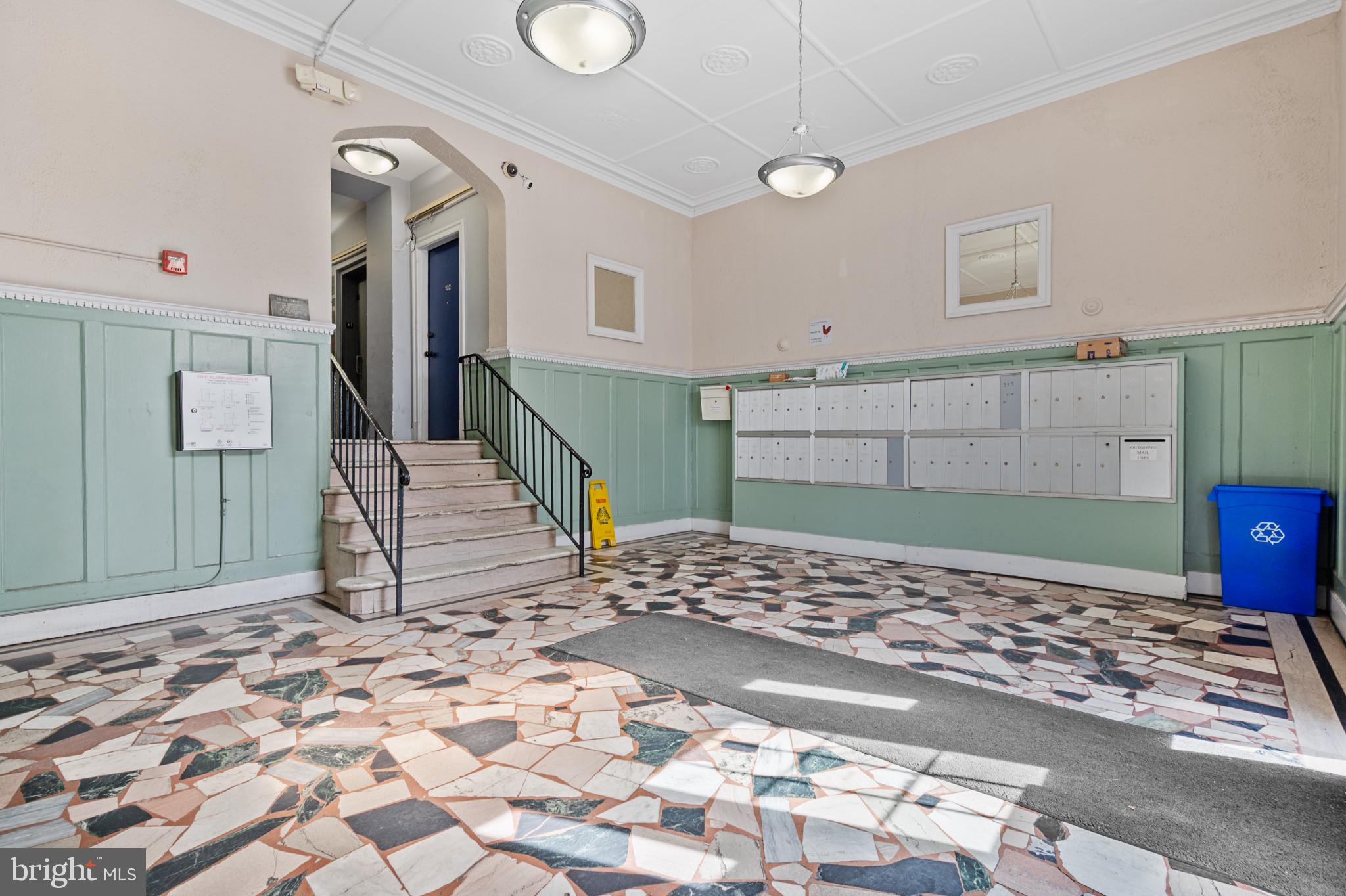 1457 Park Road Northwest, Unit 107 Washington, DC 20010 - Photo 3 of 42 Angled view of foyer upon entry of the building. M