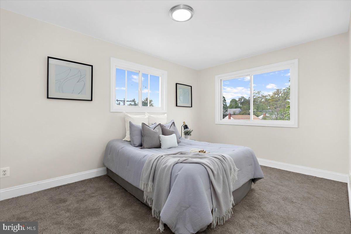 8303 Navahoe Drive Silver Spring, MD 20903 - Photo 21 of 39 a bedroom with a bed and a window