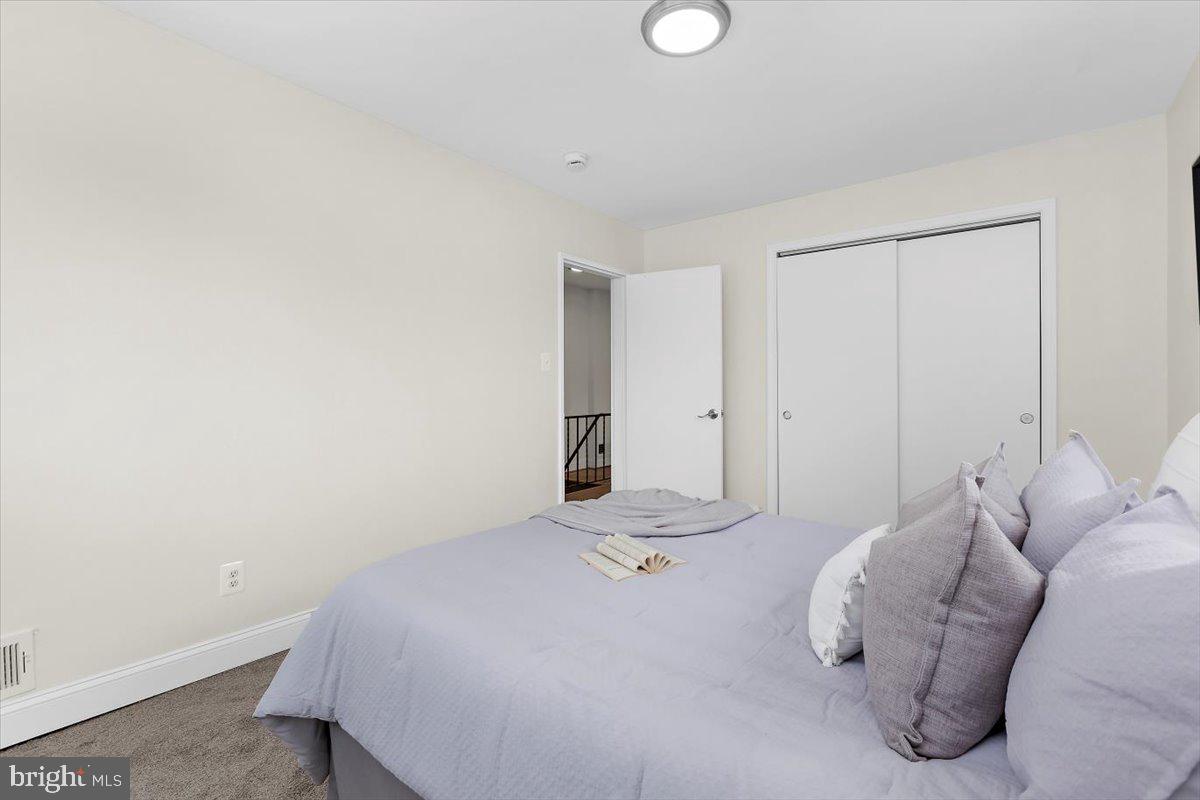 8303 Navahoe Drive Silver Spring, MD 20903 - Photo 22 of 39 a bedroom with a bed and a window