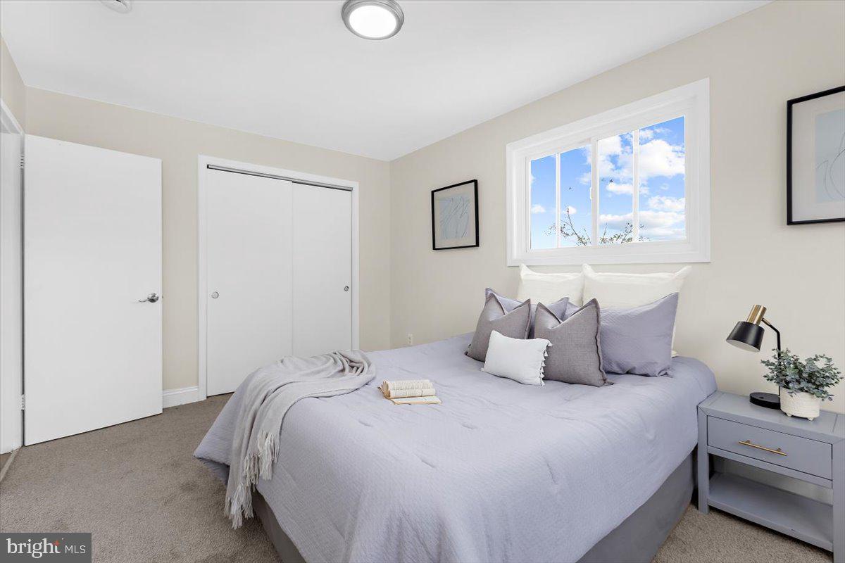 8303 Navahoe Drive Silver Spring, MD 20903 - Photo 23 of 39 a bedroom with bed and cupboard