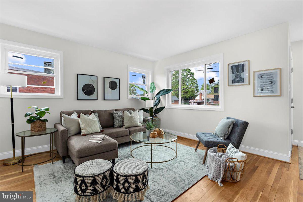 8303 Navahoe Drive Silver Spring, MD 20903 - Photo 3 of 39 a living room with furniture and wooden floor