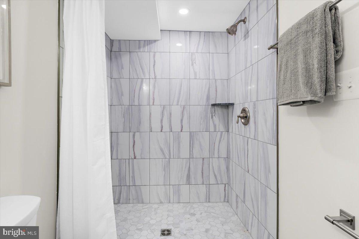 8303 Navahoe Drive Silver Spring, MD 20903 - Photo 32 of 39 a bathroom with a shower