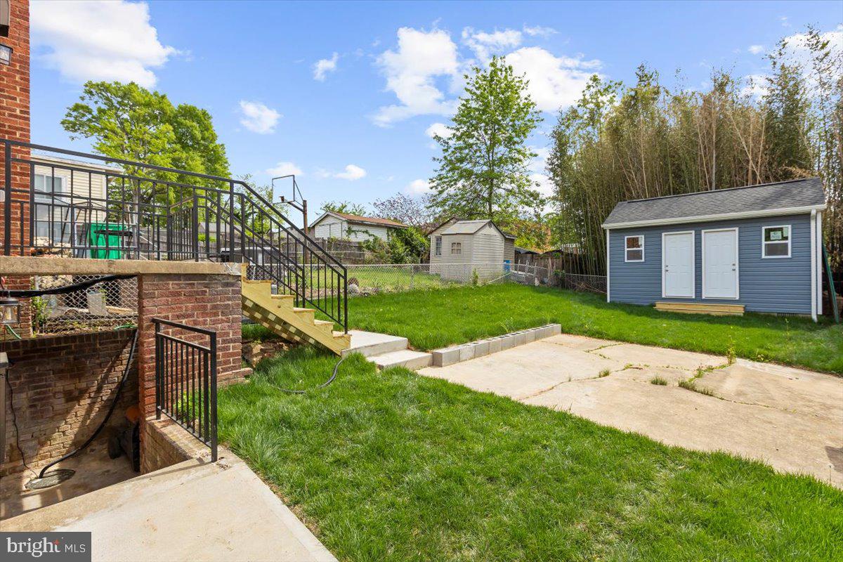 8303 Navahoe Drive Silver Spring, MD 20903 - Photo 34 of 39 a backyard of a house with lots of green space