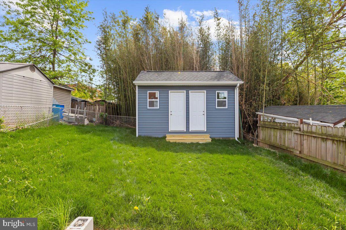 8303 Navahoe Drive Silver Spring, MD 20903 - Photo 35 of 39 a view of a house with a yard