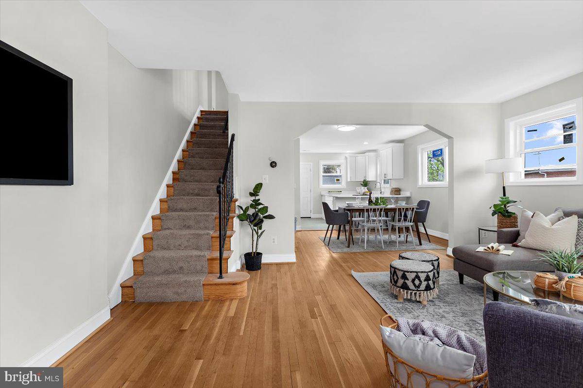 8303 Navahoe Drive Silver Spring, MD 20903 - Photo 5 of 39 a living room with furniture and a flat screen tv