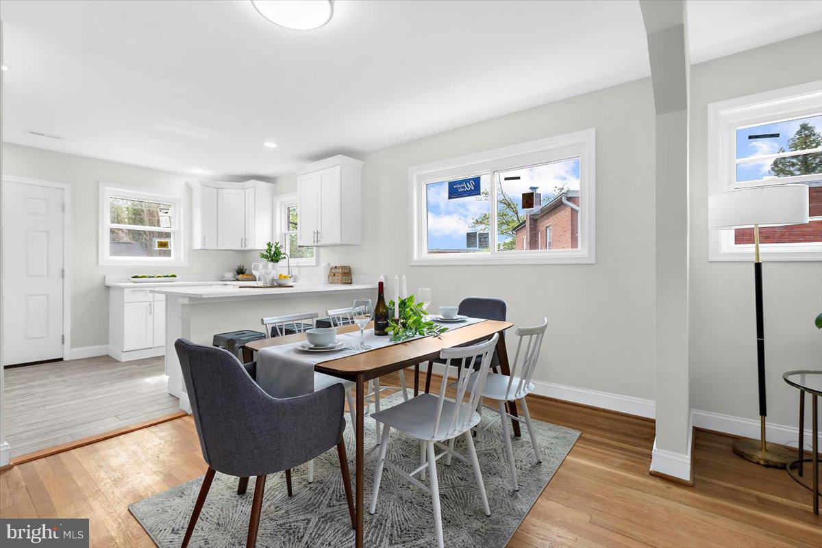 8303 Navahoe Drive Silver Spring, MD 20903 - Photo 8 of 39 a view of a dining room with furniture and wooden floor