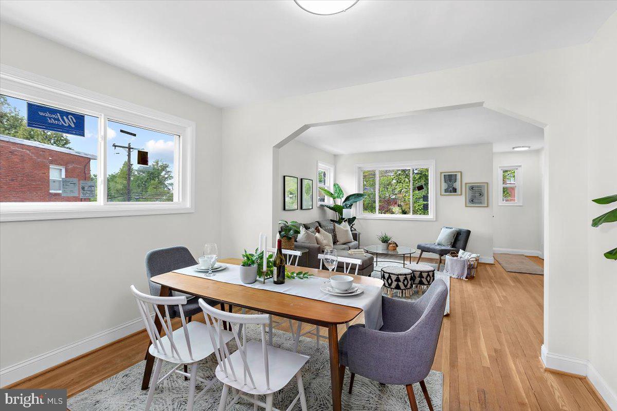 8303 Navahoe Drive Silver Spring, MD 20903 - Photo 10 of 39 a dining room with furniture a window and wooden floor