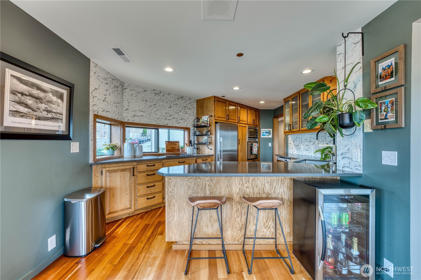507 North 3rd Street, Unit 101 Tacoma, WA 98403 - Photo 13 of 33 a kitchen with stainless steel appliances granite countertop a stove and cabinets