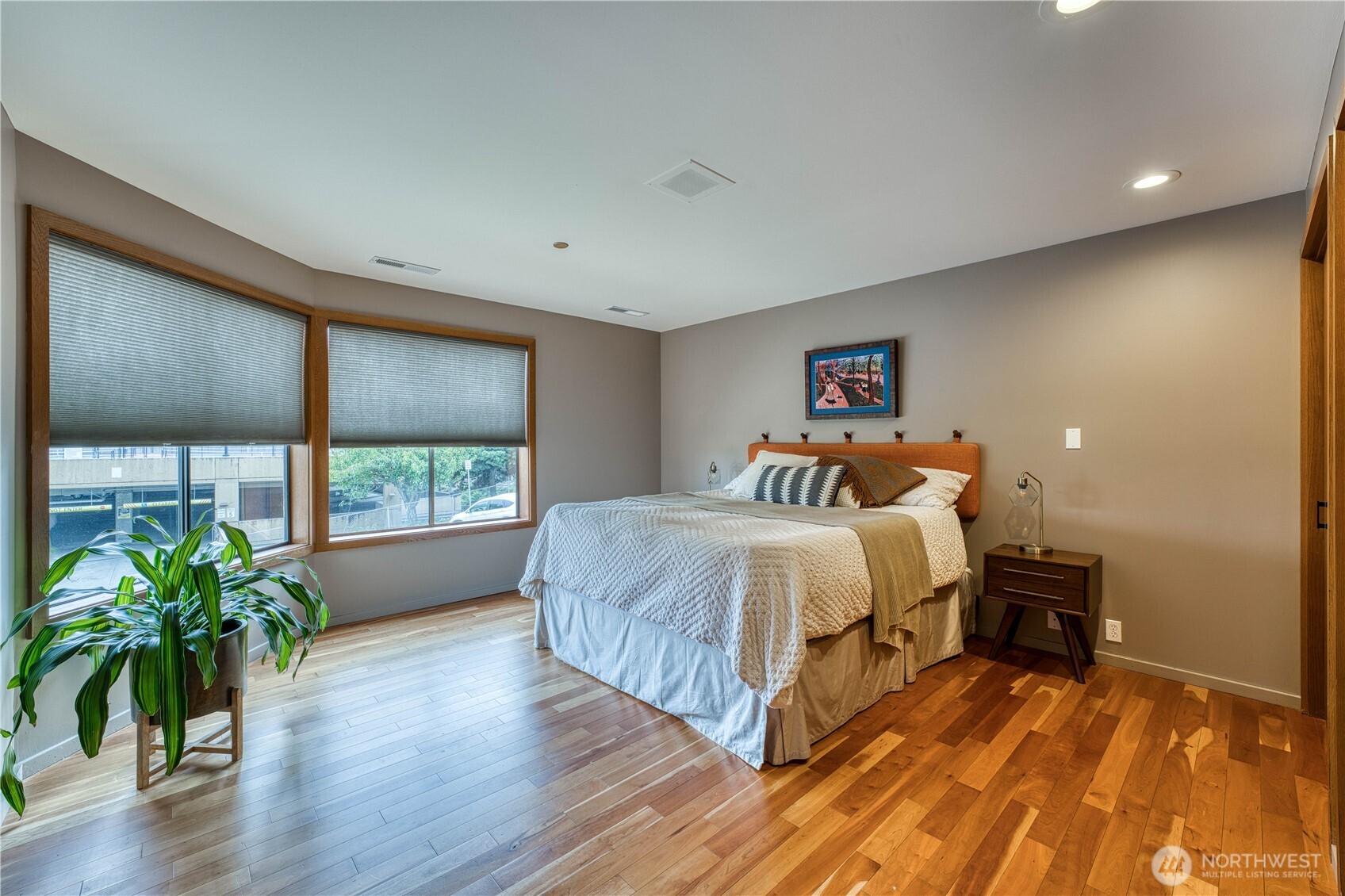 507 North 3rd Street, Unit 101 Tacoma, WA 98403 - Photo 19 of 33 a spacious bedroom with a bed and a large window