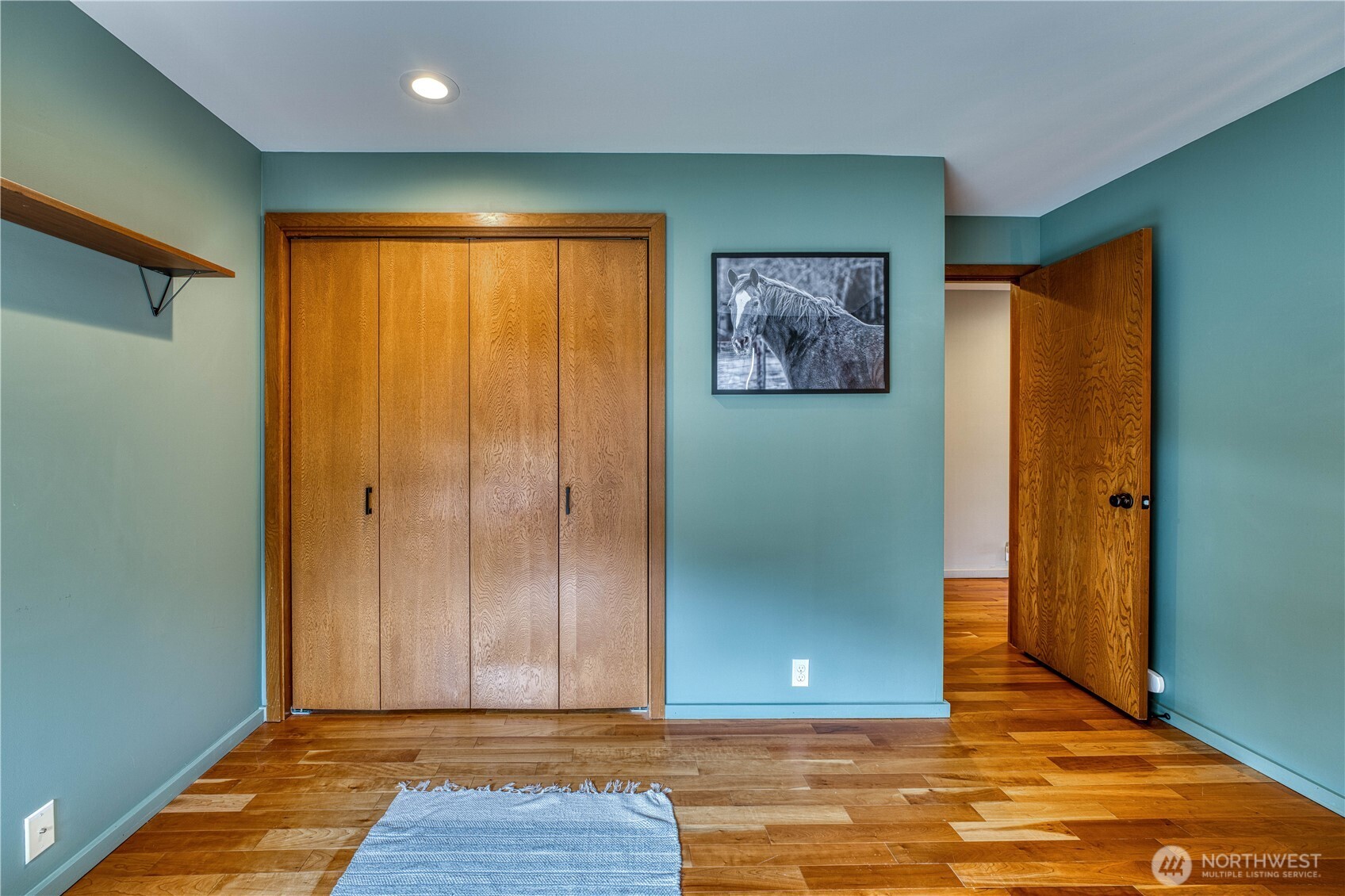 507 North 3rd Street, Unit 101 Tacoma, WA 98403 - Photo 27 of 33 a view of an empty room with wooden floor and a window