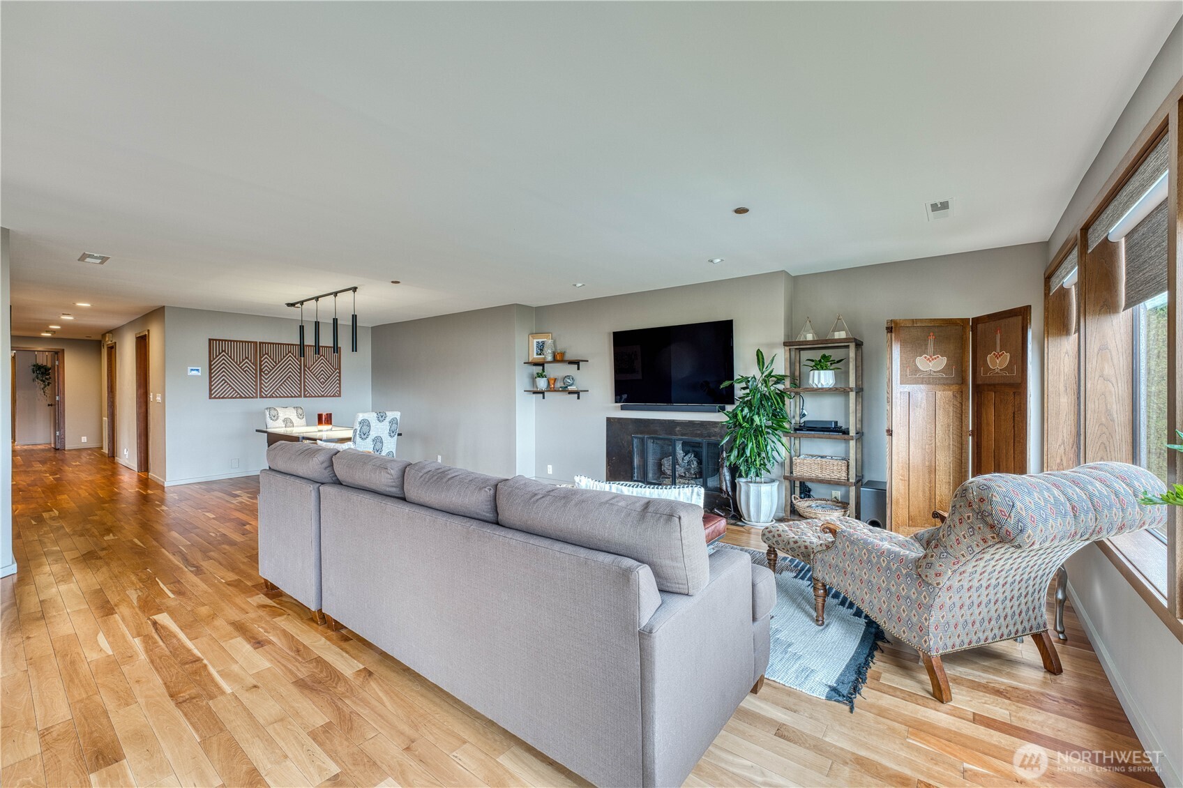 507 North 3rd Street, Unit 101 Tacoma, WA 98403 - Photo 8 of 33 a living room with furniture and a flat screen tv