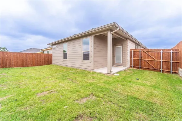 a view of a backyard with a garden