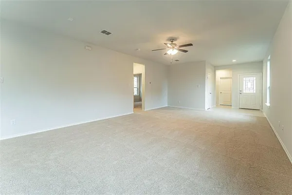 a view of a livingroom with a kitchen