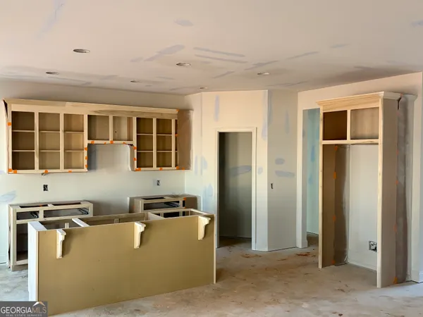 a living room with furniture and windows