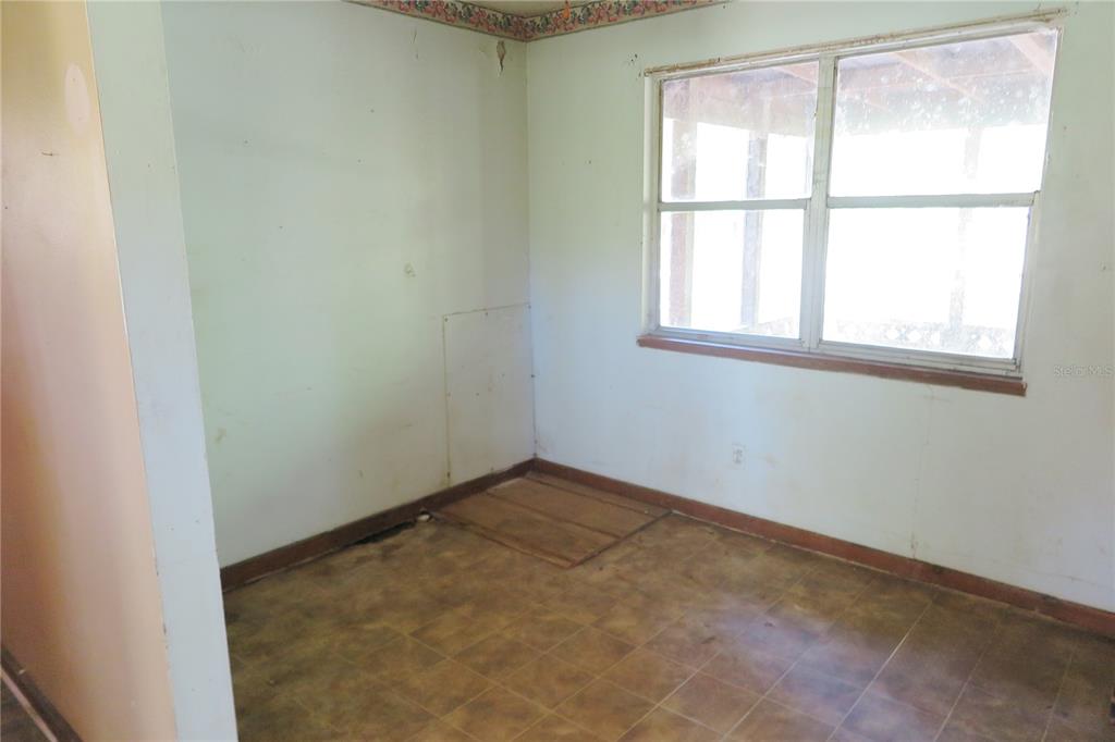 153-UNIT Ranch Road San Mateo, FL 32187 - Photo 15 of 34 an empty room with a window