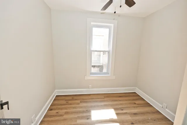 a bathroom with a toilet a sink and a mirror