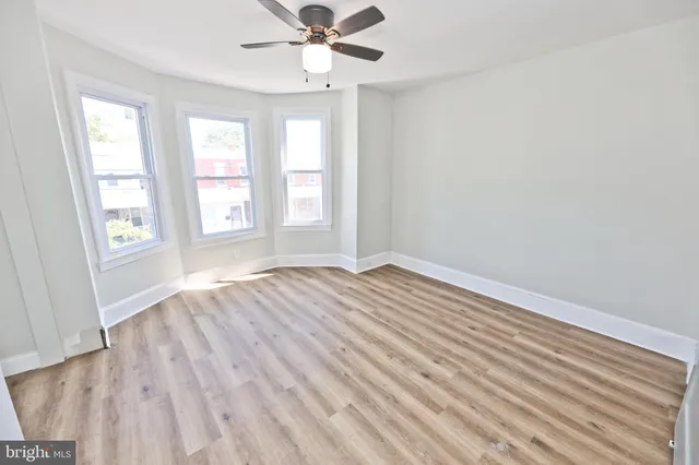 a view of a livingroom with wooden floor
