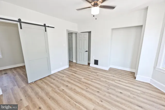 a white toilet sitting next to a bathroom sink