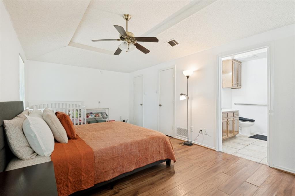7410 Jessica Way Rowlett, TX 75088 - Photo 20 of 25 a bedroom with a bed and closet