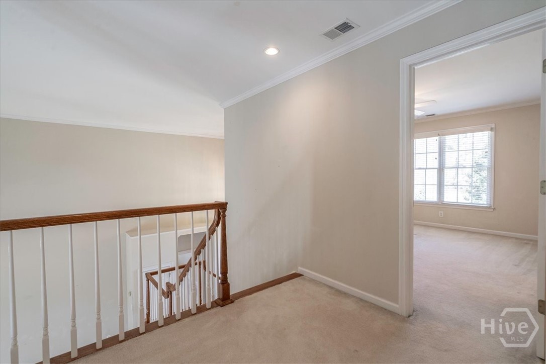 305 Crystal Court Athens, GA 30606 - Photo 43 of 51 Upstairs hall and Bedroom with walk-in closet and en suite bath