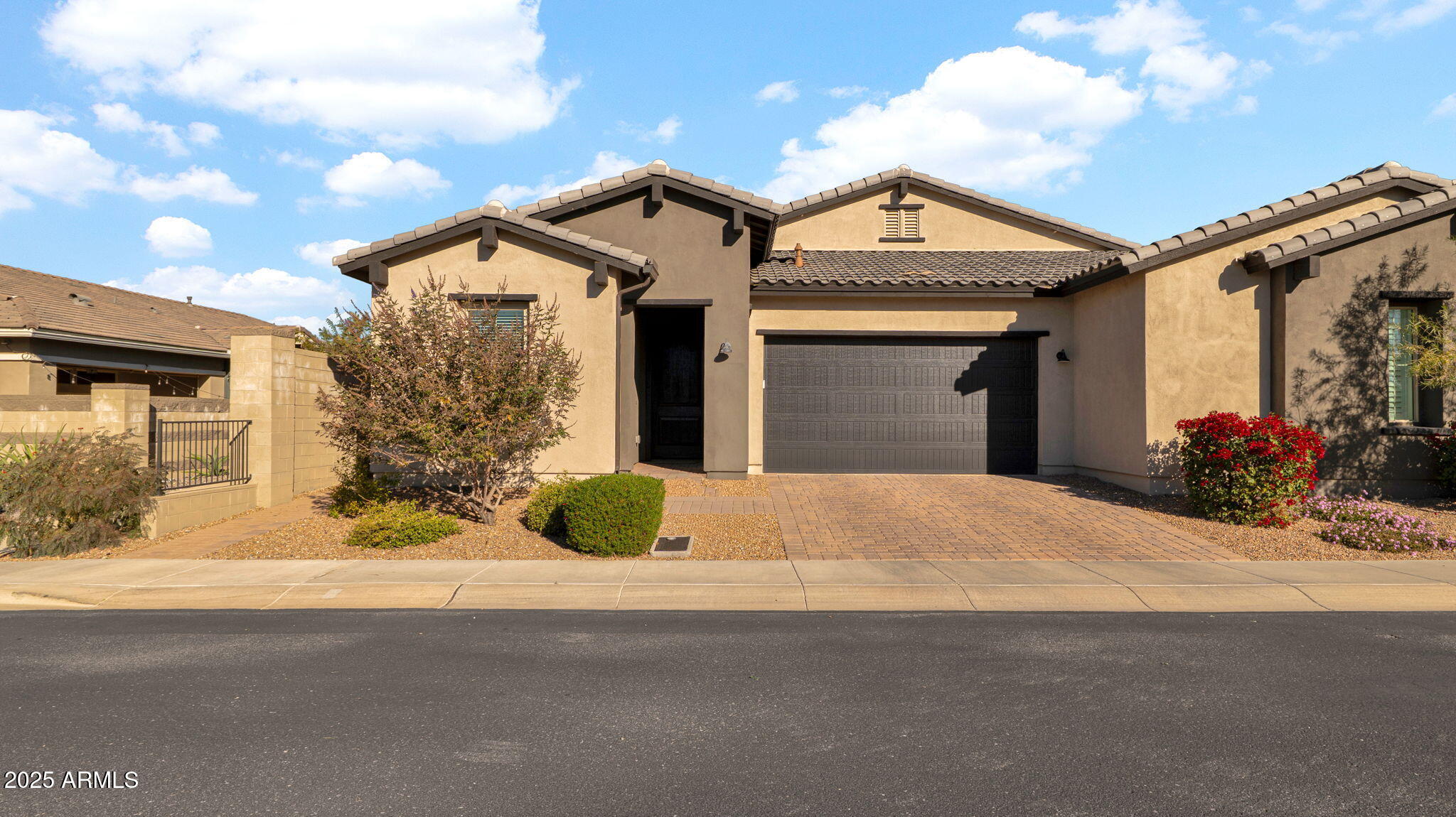 38500 North School House Road, Unit 8 Cave Creek, AZ 85331 - Photo 1 of 35 a front view of a house with a yard and garage