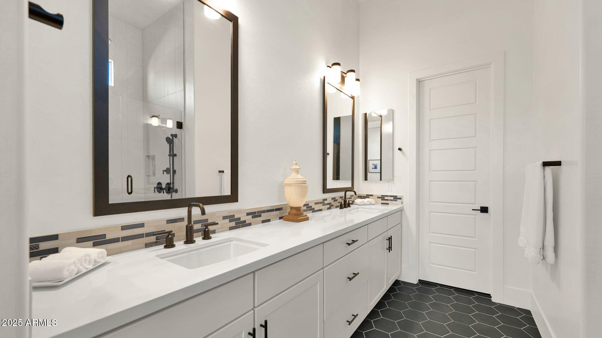 38500 North School House Road, Unit 8 Cave Creek, AZ 85331 - Photo 15 of 35 a bathroom with a double vanity sink and a mirror
