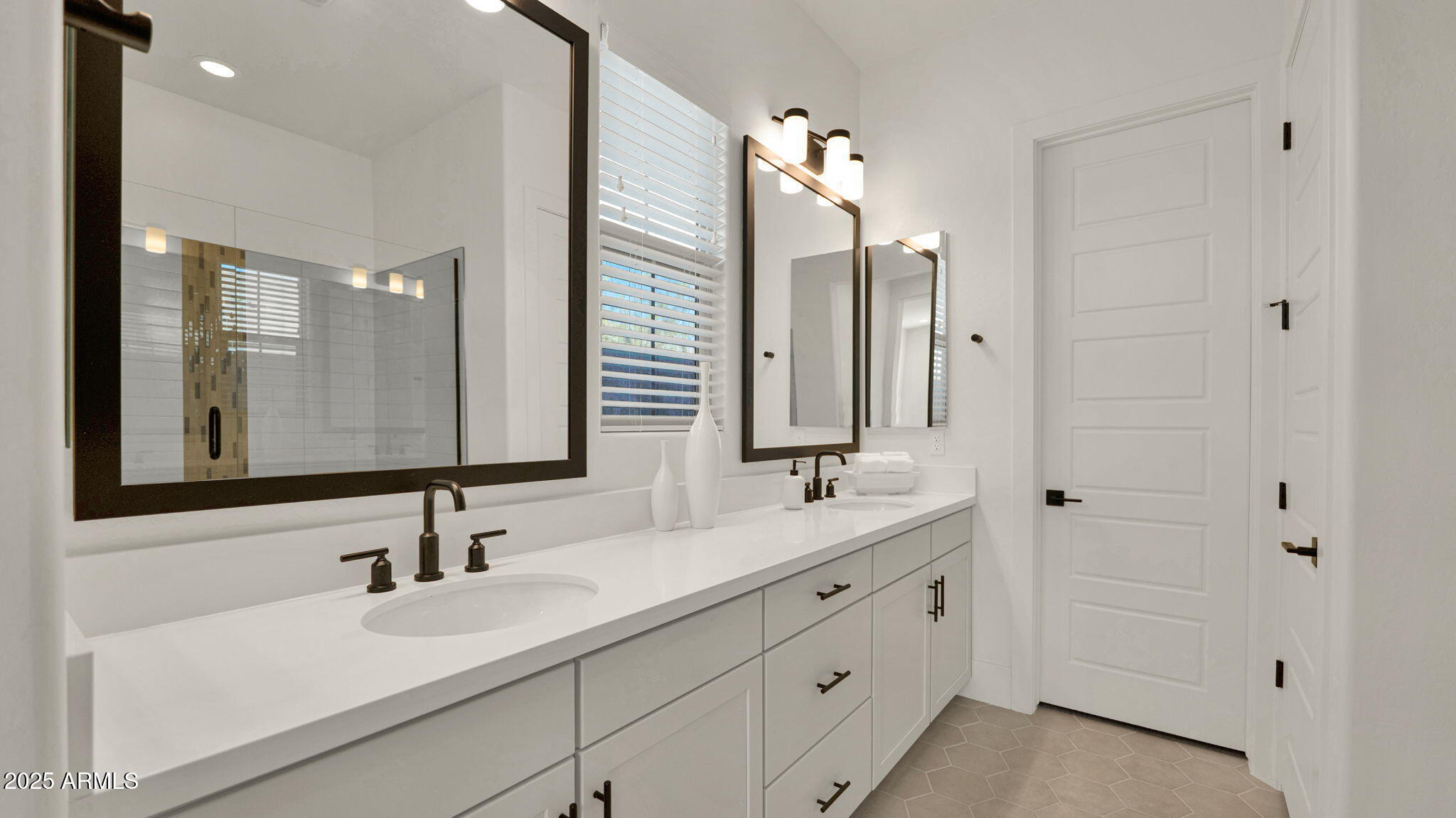38500 North School House Road, Unit 8 Cave Creek, AZ 85331 - Photo 21 of 35 a bathroom with double vanity sink and mirror