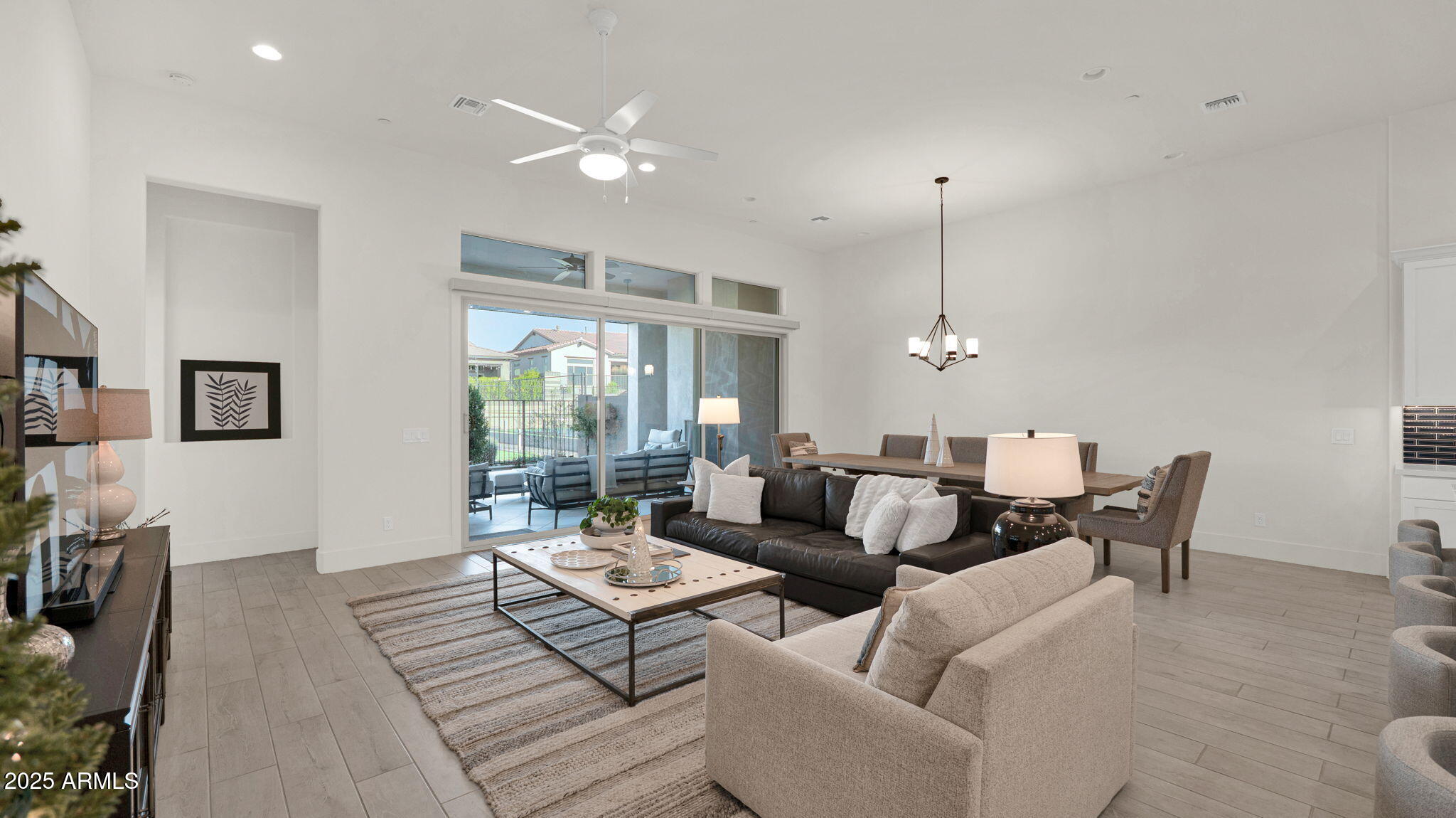 38500 North School House Road, Unit 8 Cave Creek, AZ 85331 - Photo 27 of 35 a living room with furniture a rug and a chandelier