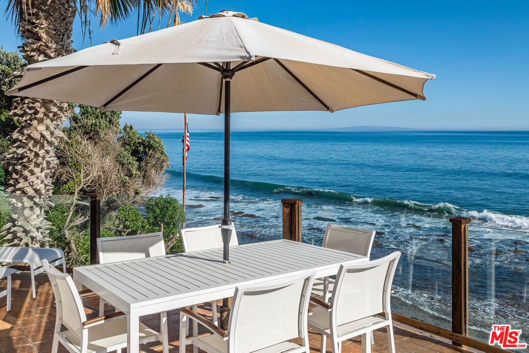 24408 Malibu Road Malibu, CA 90265 - Photo 17 of 39 a view of deck with patio table and chairs